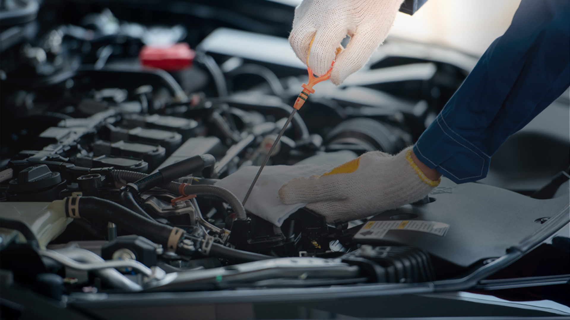 a mechanic is fixing a car